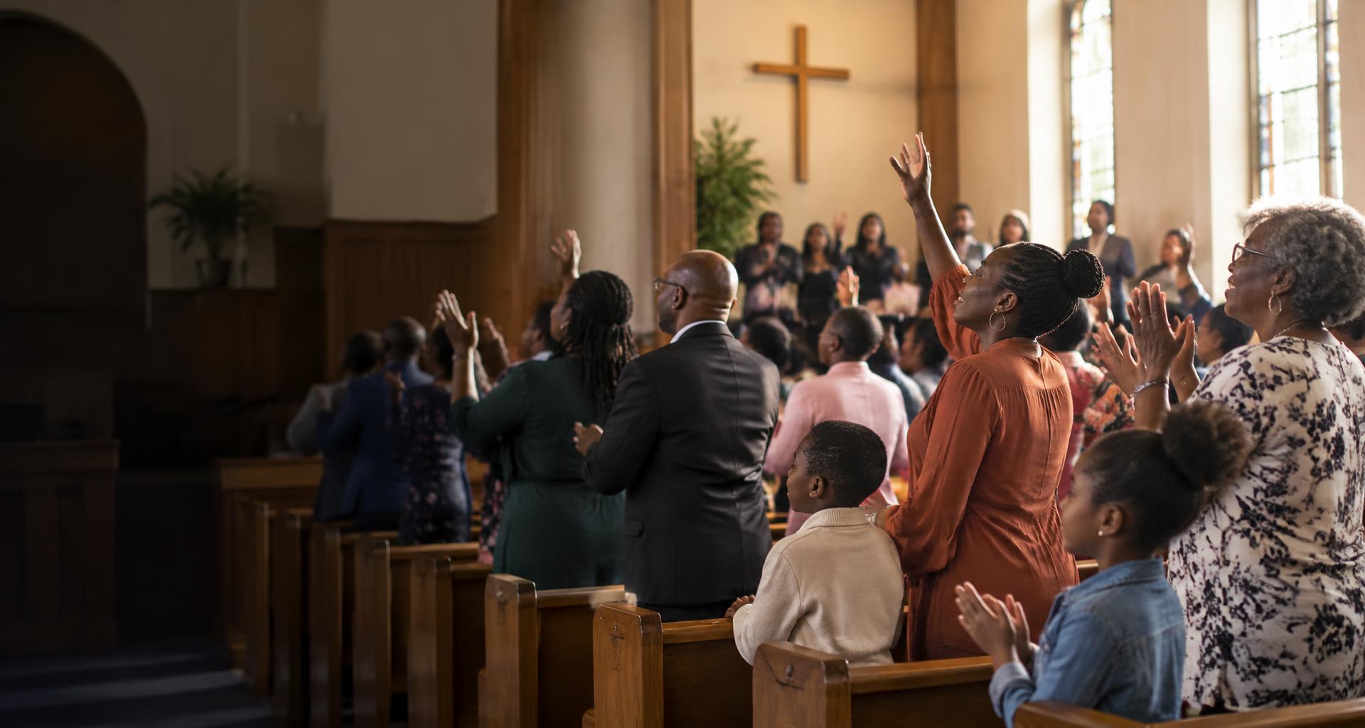 Illustrative image of families worshipping together in a church
